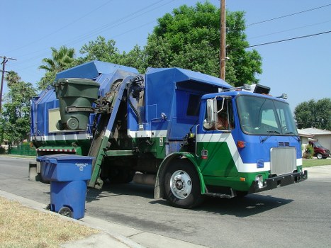 Waste collection trucks in Sudbury streets